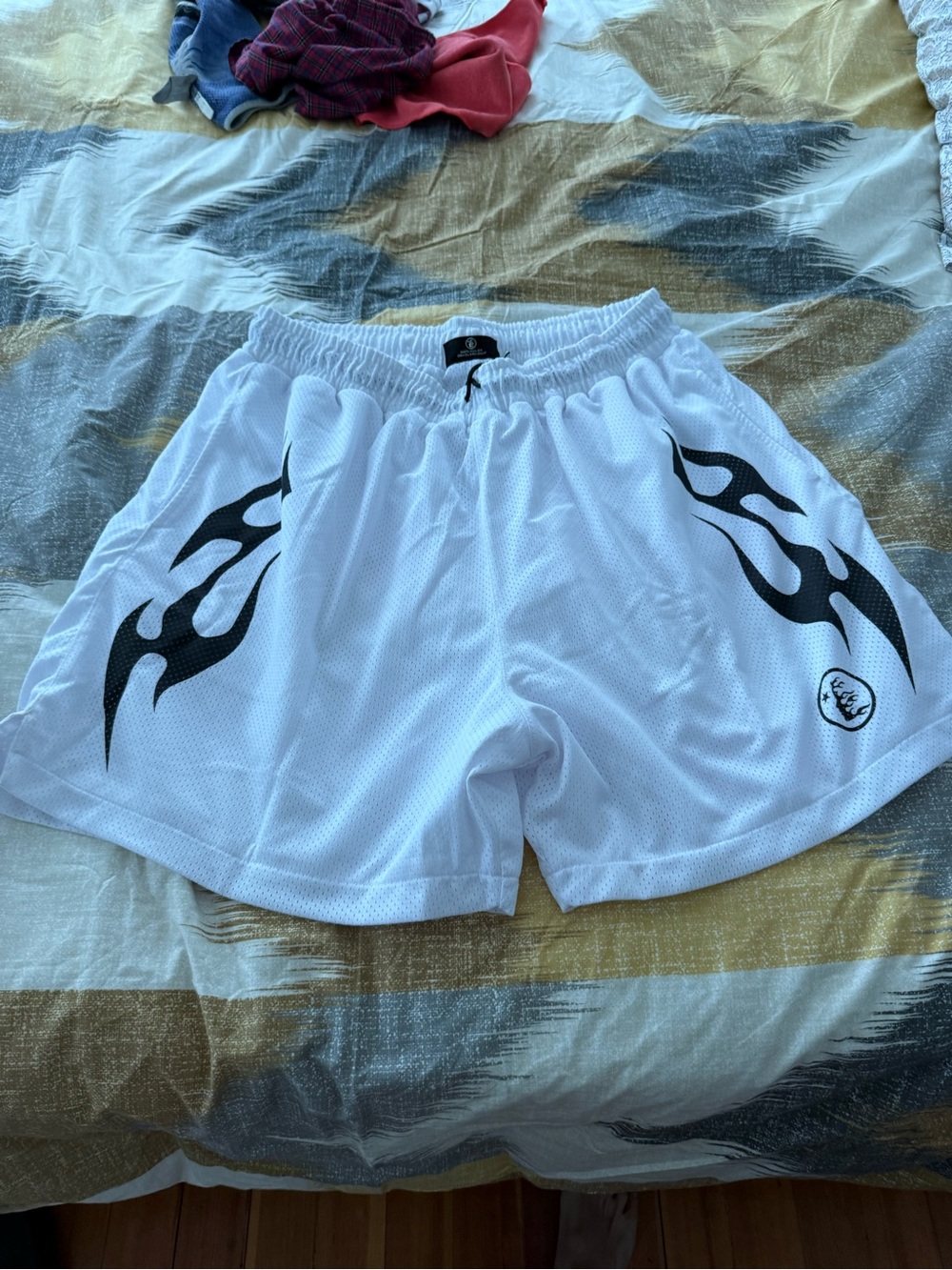 Hellstar White Men’s Mesh Athletic Shorts with Black Flame Graphics